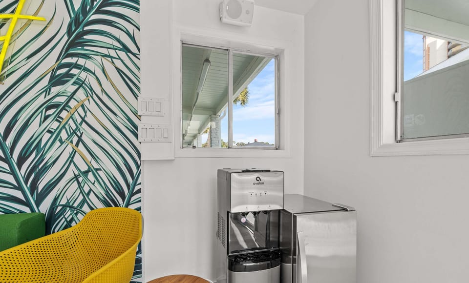 Filtered water dispenser in the shared lounge area for guest use