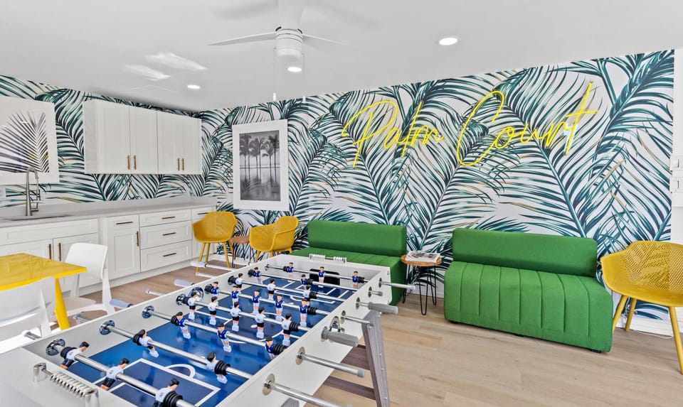 Lounge with foosball, tables, chairs and air conditioning, Great for evenings or rainy days. 