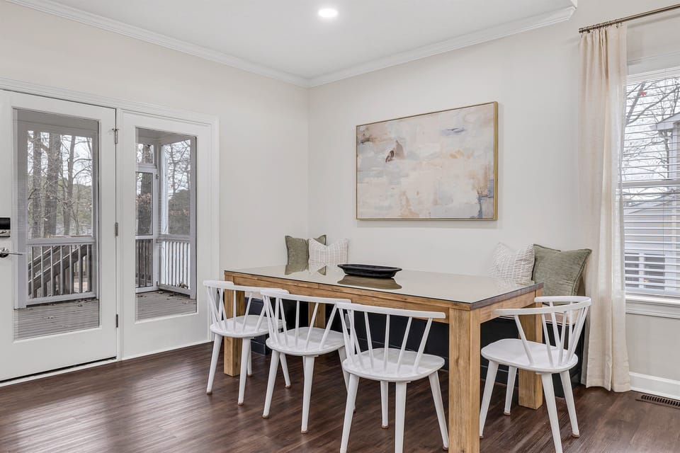 Dining table for 8+ includes comfortable padded banquette  seating and chairs