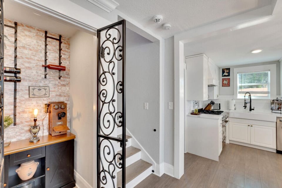 A cellar with character – wine, vintage phones, and charm.