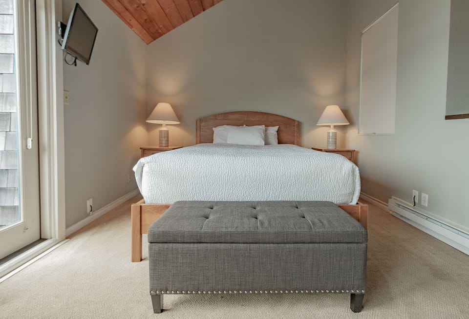A serene bedroom with soft lighting and warm accents, creating the perfect retreat for relaxation.
