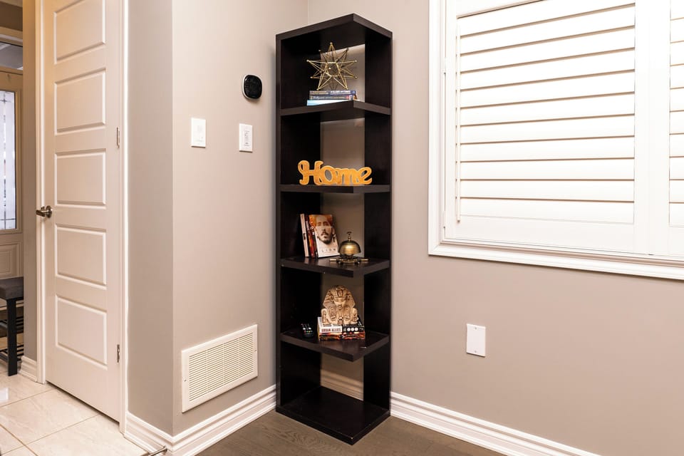 Decorative bookshelf with charming accents for a homey touch.