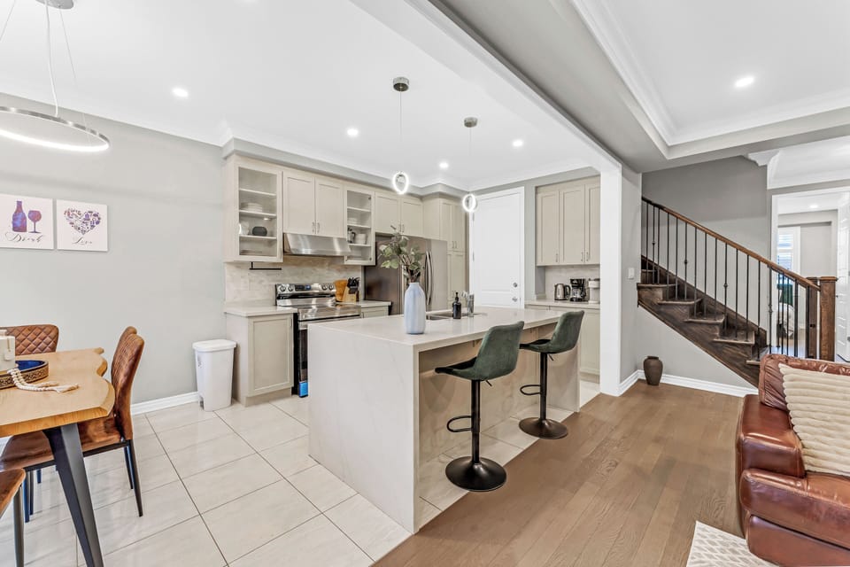 Modern kitchen with ample counter space and bar seating.
