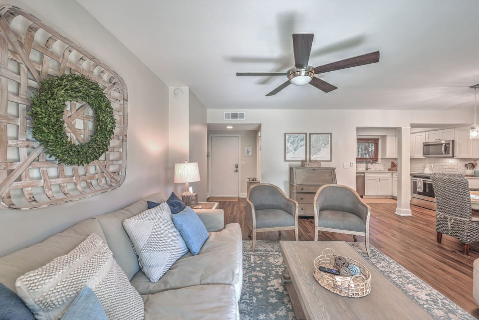Unwind on the comfortable floral sofa or the plush leather recliner after a day of fun.