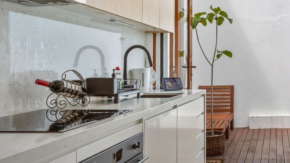 Fully equipped kitchen with stove, oven, sink, and all the cookware you need.