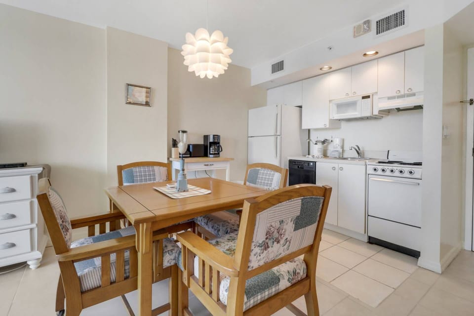 The kitchen has an oven, microwave, refrigerator/freezer and compact dishwasher.