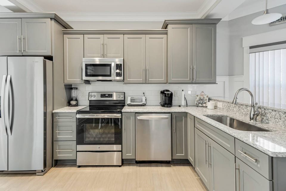 Kitchen comes complete with all appliances and spacious countertops for easy meal preparation.