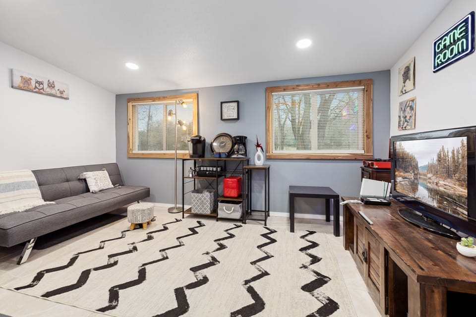 The game room - an extra living space featuring more seating, a coffee bar, plenty of games, and a Smart TV with a Wii gaming console!