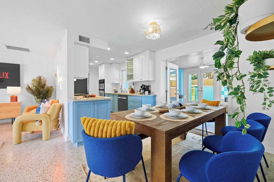 Airy dining area w/ modern touches and a cheerful, welcoming vibe.
