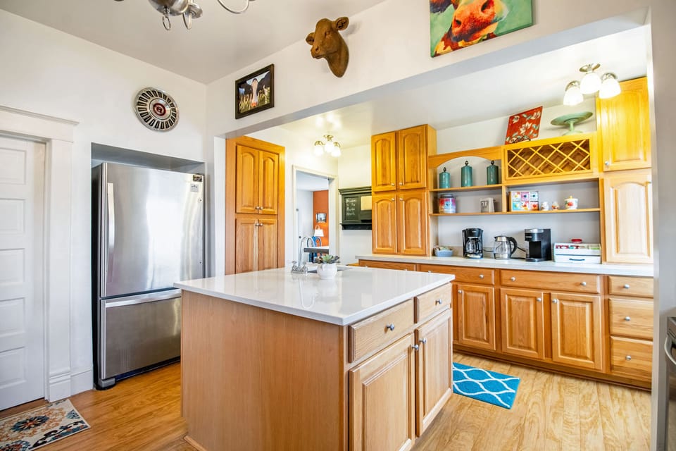 Full kitchen with gas stove top, oven, dishwasher, refrigerator, coffee maker, and more!