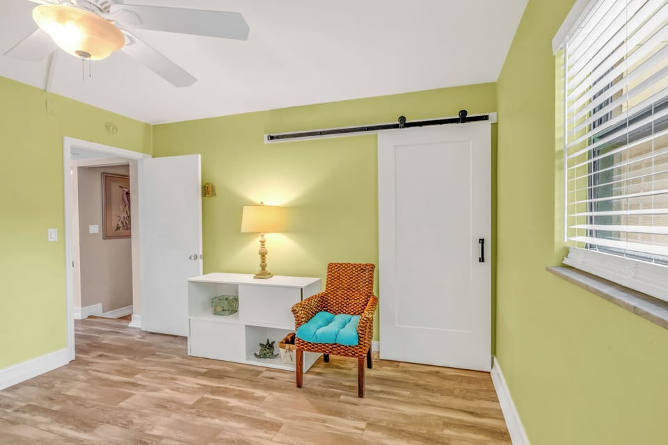 Guest bedroom 2 full beds with twin bunk over 1