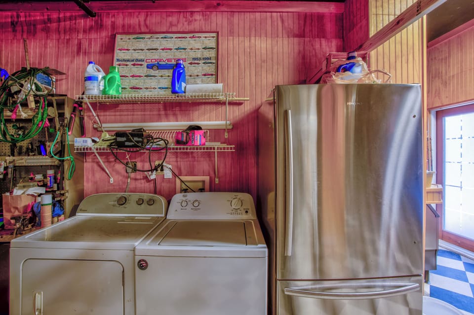 Washer, dryer, and extra fridge located downstairs