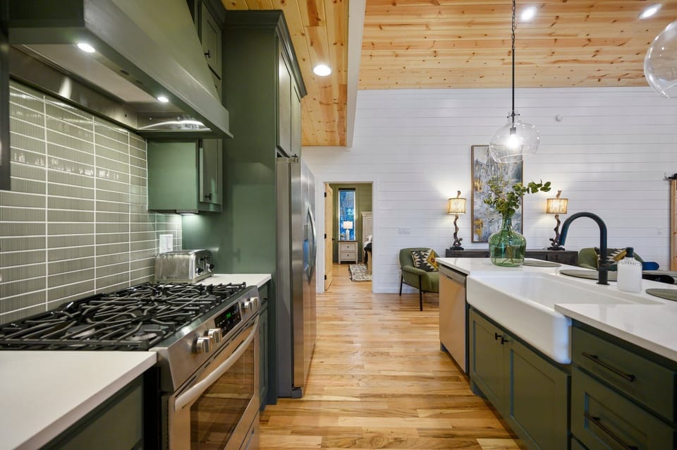 Modern kitchen with sleek finishes, open layout, and warm rustic charm