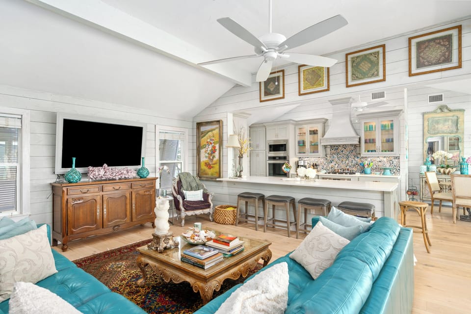 Plush turquoise sectional offers cozy seating for movies & relaxation.