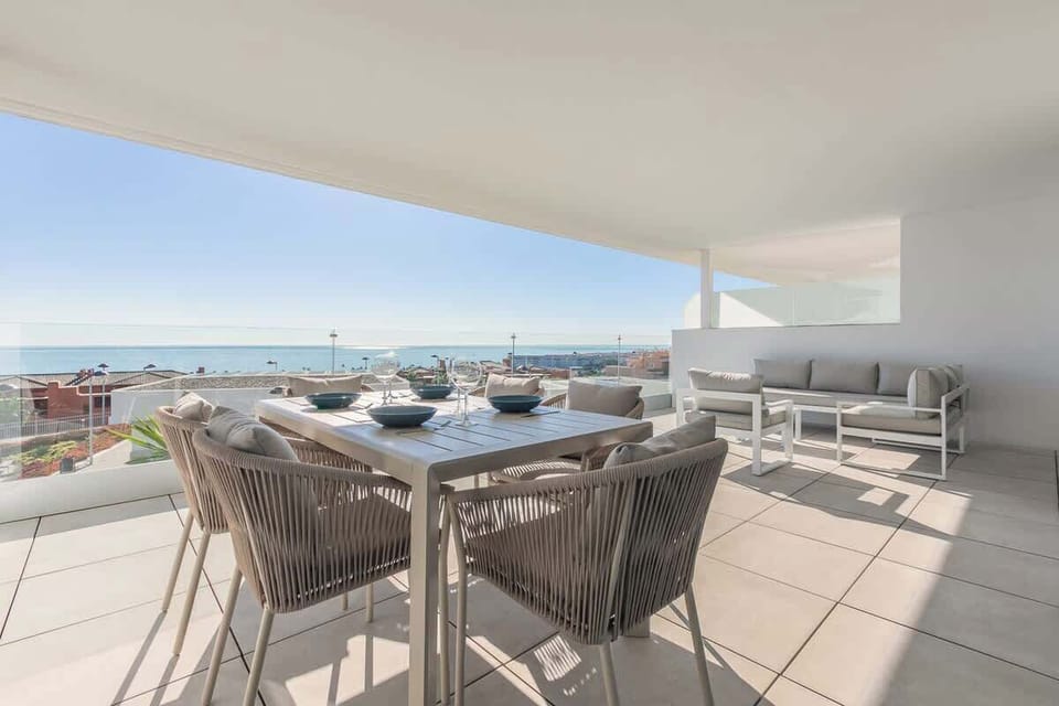 Large Private Terrace offering panoramic sea views. Equipped with sofa, coffee table and outdoor dining table and chairs