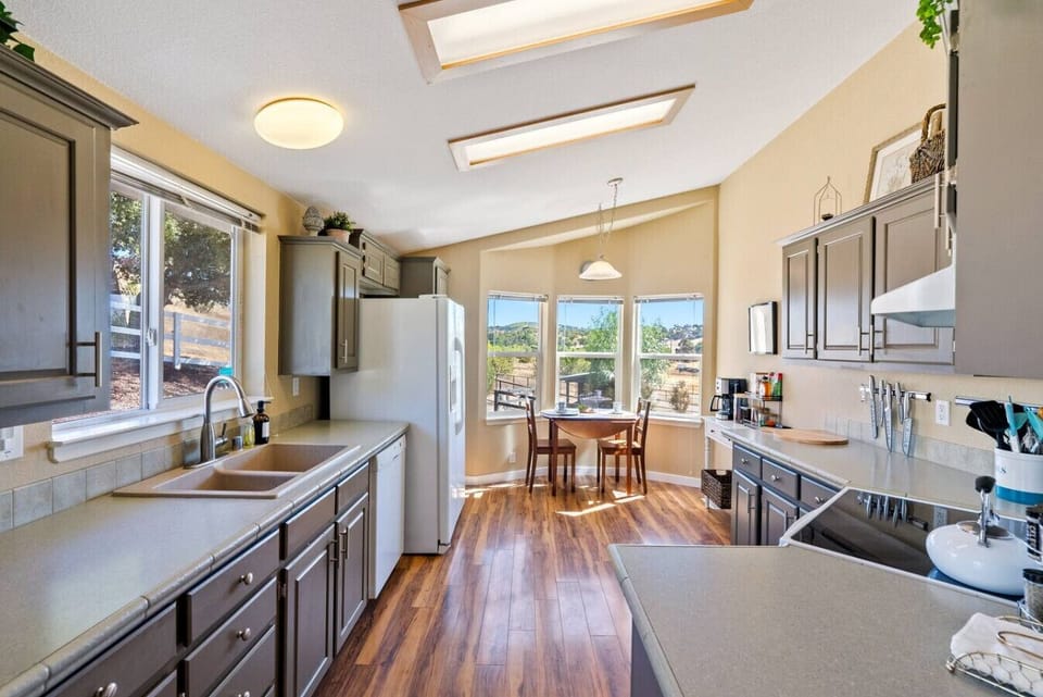 Charming kitchen and cozy nook in the main house at River Road Retreat.