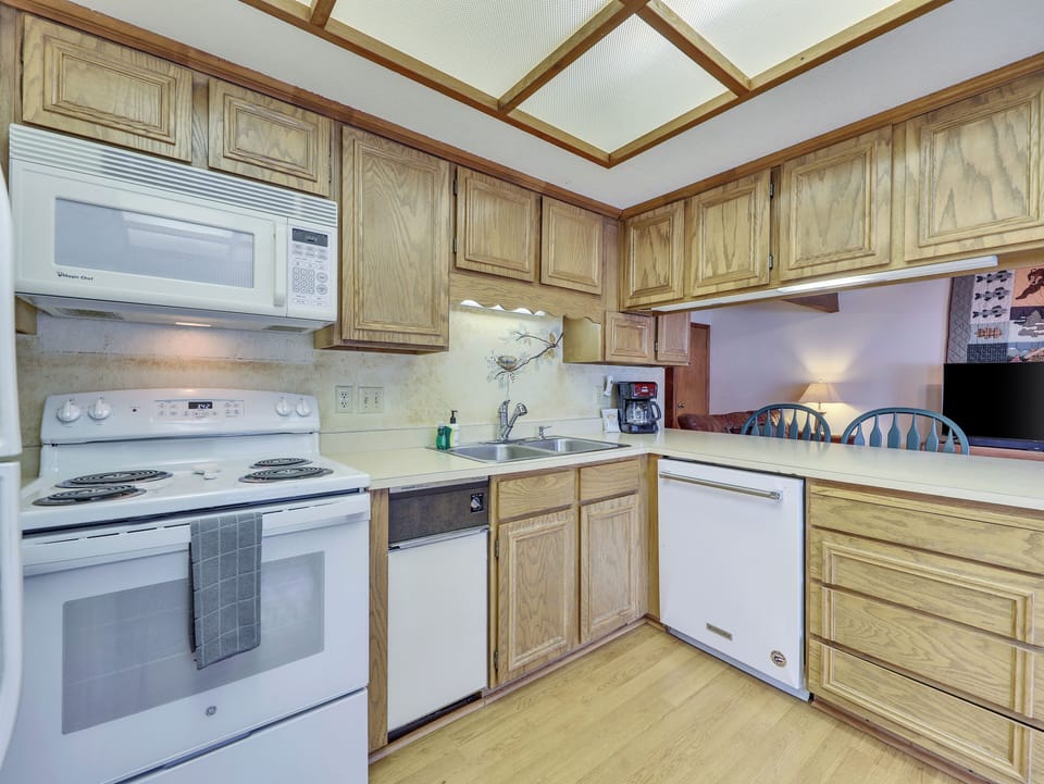 View of the fully equipped kitchen, perfect for preparing meals and enjoying a cozy night in after a day on the slopes