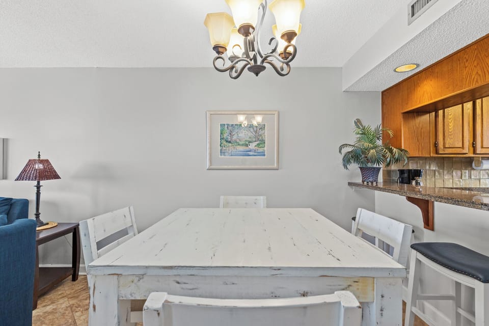 Dining Room Table with Seating for Four and Counter Seating for Two