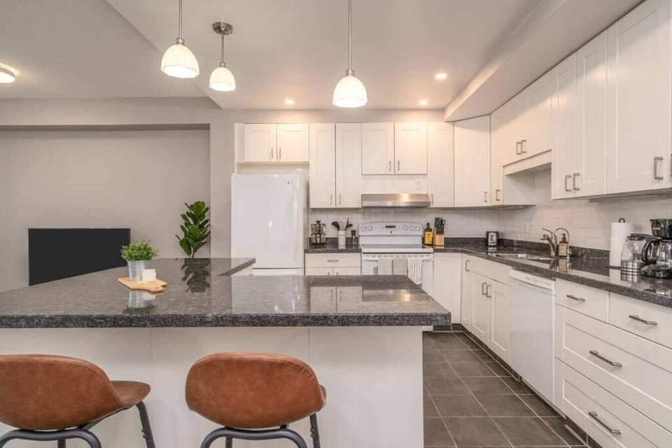 The kitchen’s open layout allows you to move freely as you prepare meals, with everything you need at your fingertips.