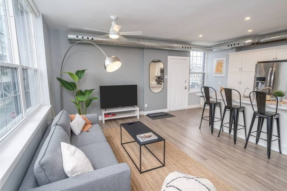 You are surrounded by tasteful decor and warm tones, making the living room a perfect setting for any occasion.