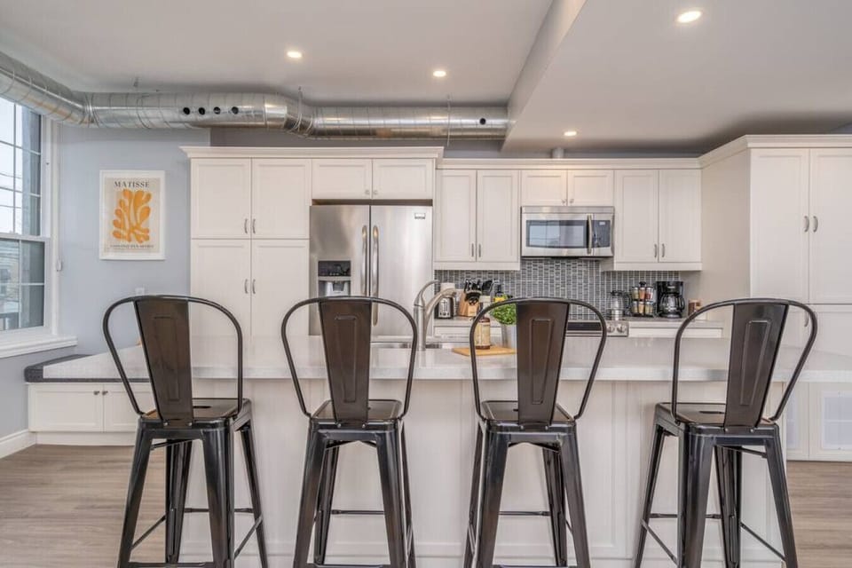 The dining room is bathed in natural light, creating a bright and inviting space where every meal feels special.