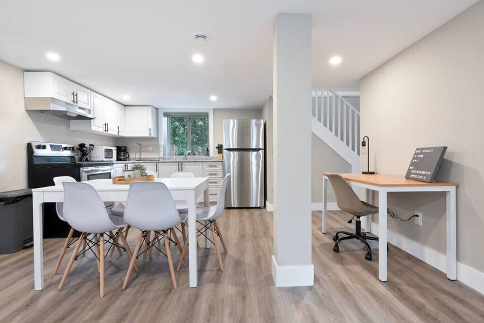 Elegant dining area with a large table and comfortable seating, perfect for gathering with family and friends for a meal.