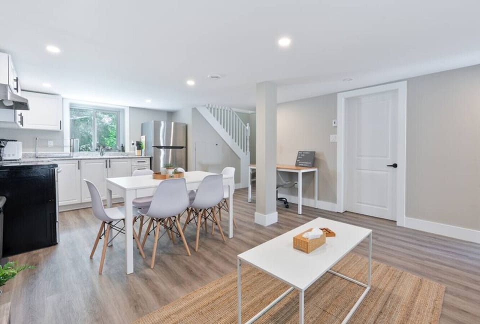 Elegant dining area with a large table and comfortable seating, perfect for gathering with family and friends for a meal.