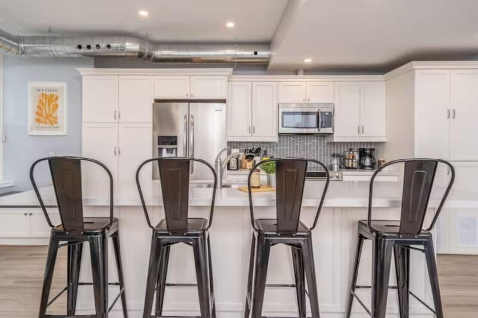 The spacious dining room invites you to savor every moment, whether enjoying a quiet meal or hosting a festive gathering.