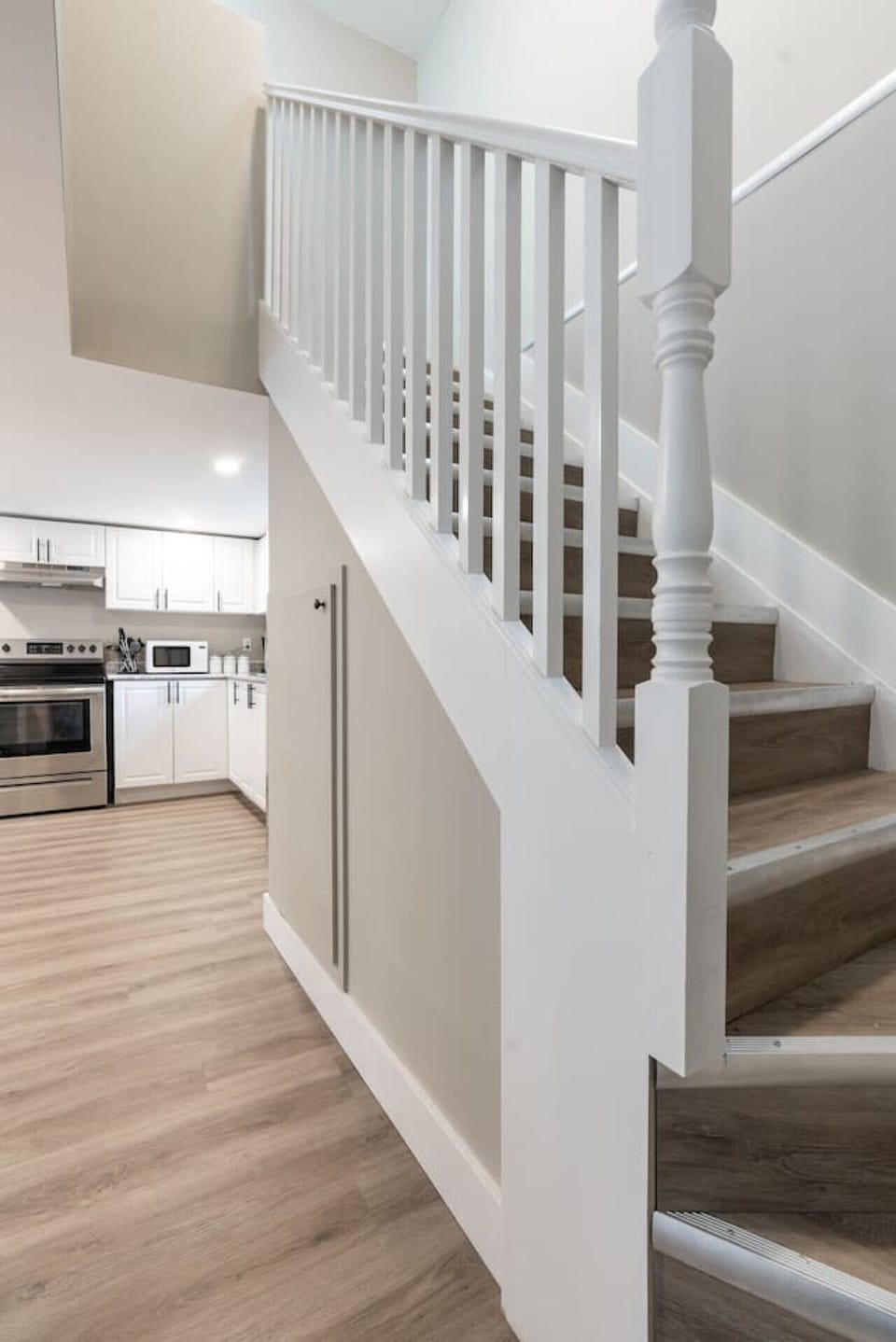 You feel a sense of continuity as you climb the stairs, moving seamlessly between the different levels of the home.