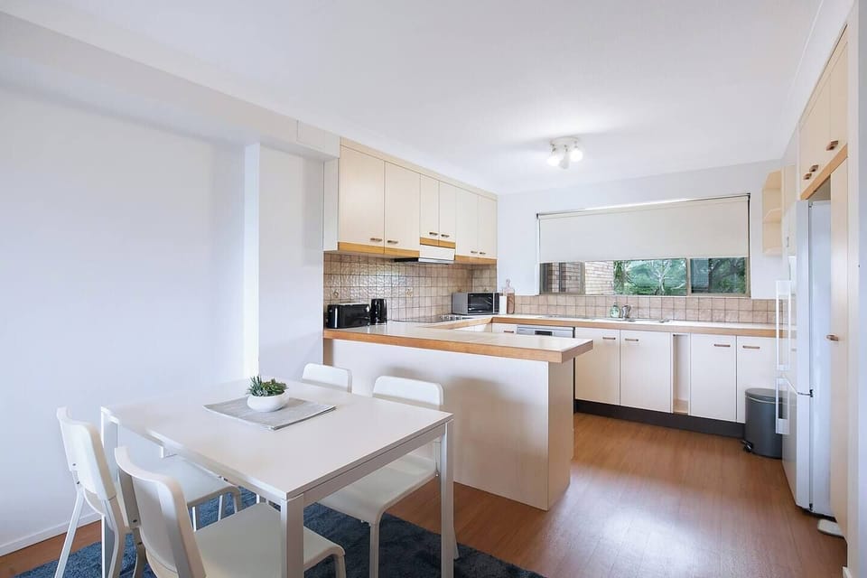 An inviting, open-plan layout includes a four-seater table where you can share meals. 