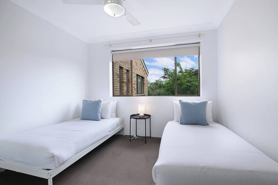 The light and airy second bedroom includes two single beds, making this an ideal stay for families.