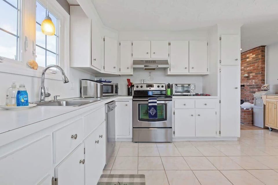 A full kitchen with stainless steel appliances