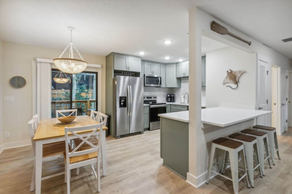 Kitchen and dining area with sliders leading to rear deck