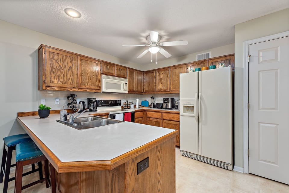 Indoors, Kitchen, Ceiling Fan, Refrigerator, Microwave