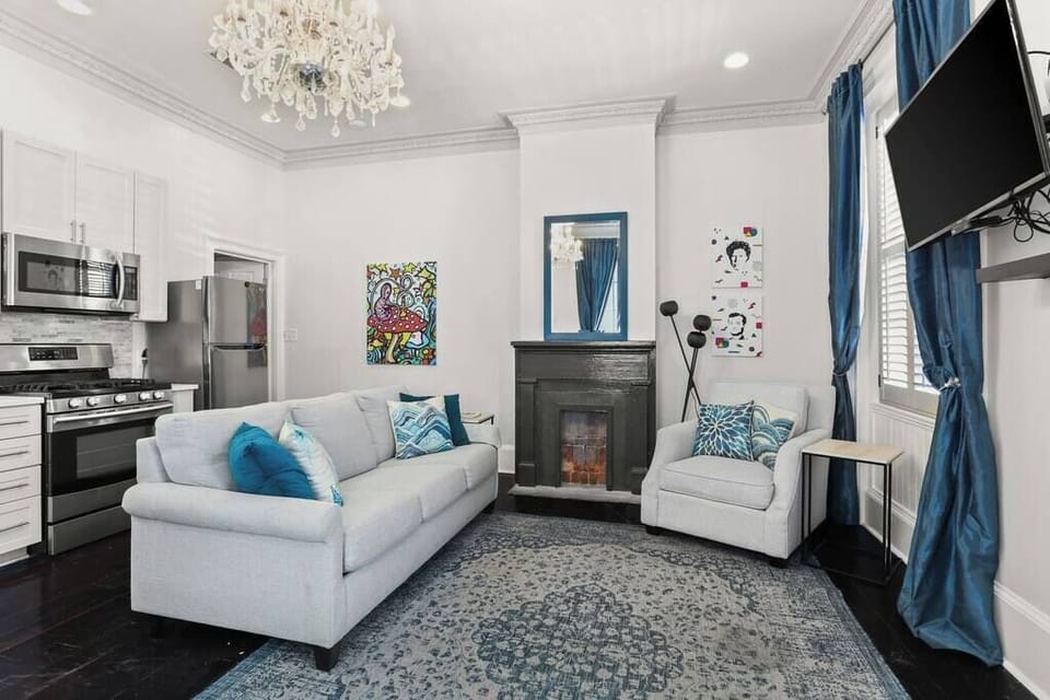 Open Concept Living, Dining and Kitchen area with sofa bed. 