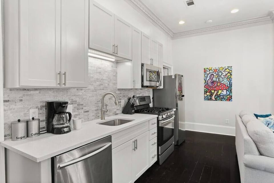 Kitchen featuring gas oven and stainless steel appliances.