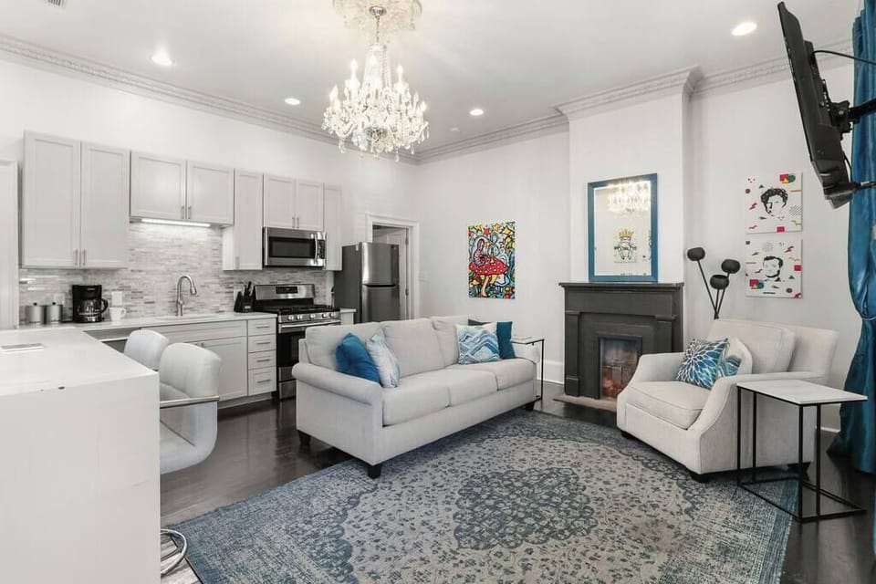 Open Concept Living, Dining and Kitchen area with sofa bed. 