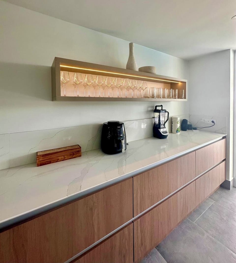 Fully equipped Kitchen with top appliances and large island with 4 bar chairs