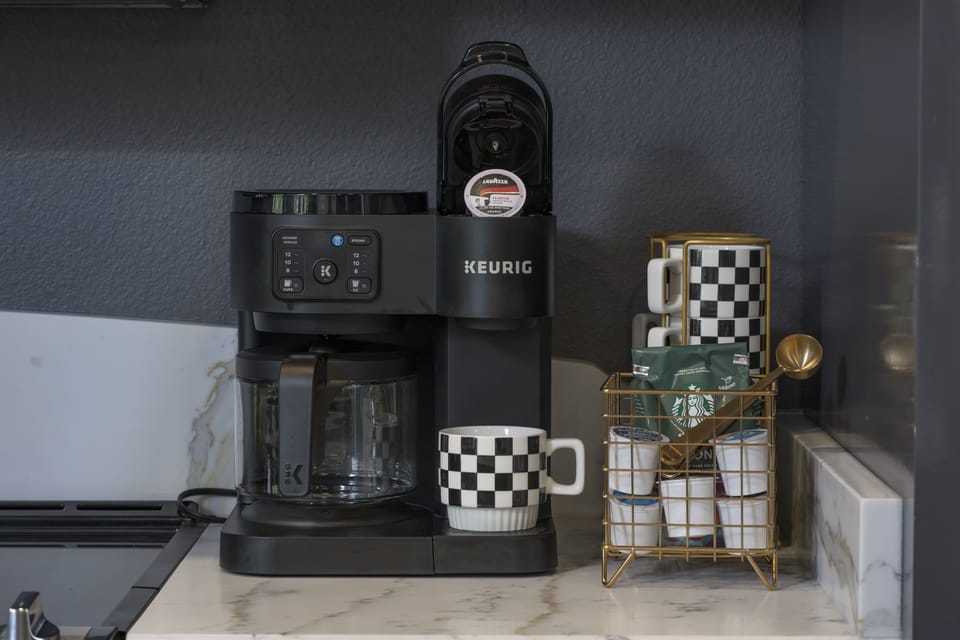 Coffee bar with Keurig cups as well as coffee pot capabilities.