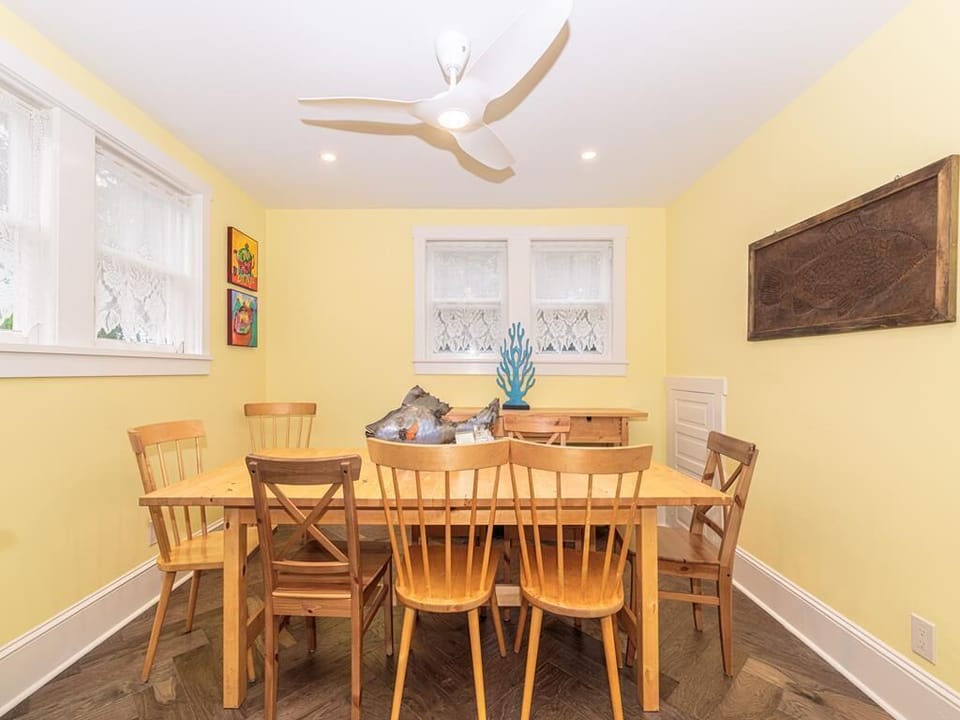 Bright and airy dining space surrounded by windows, creating the perfect setting for memorable meals.