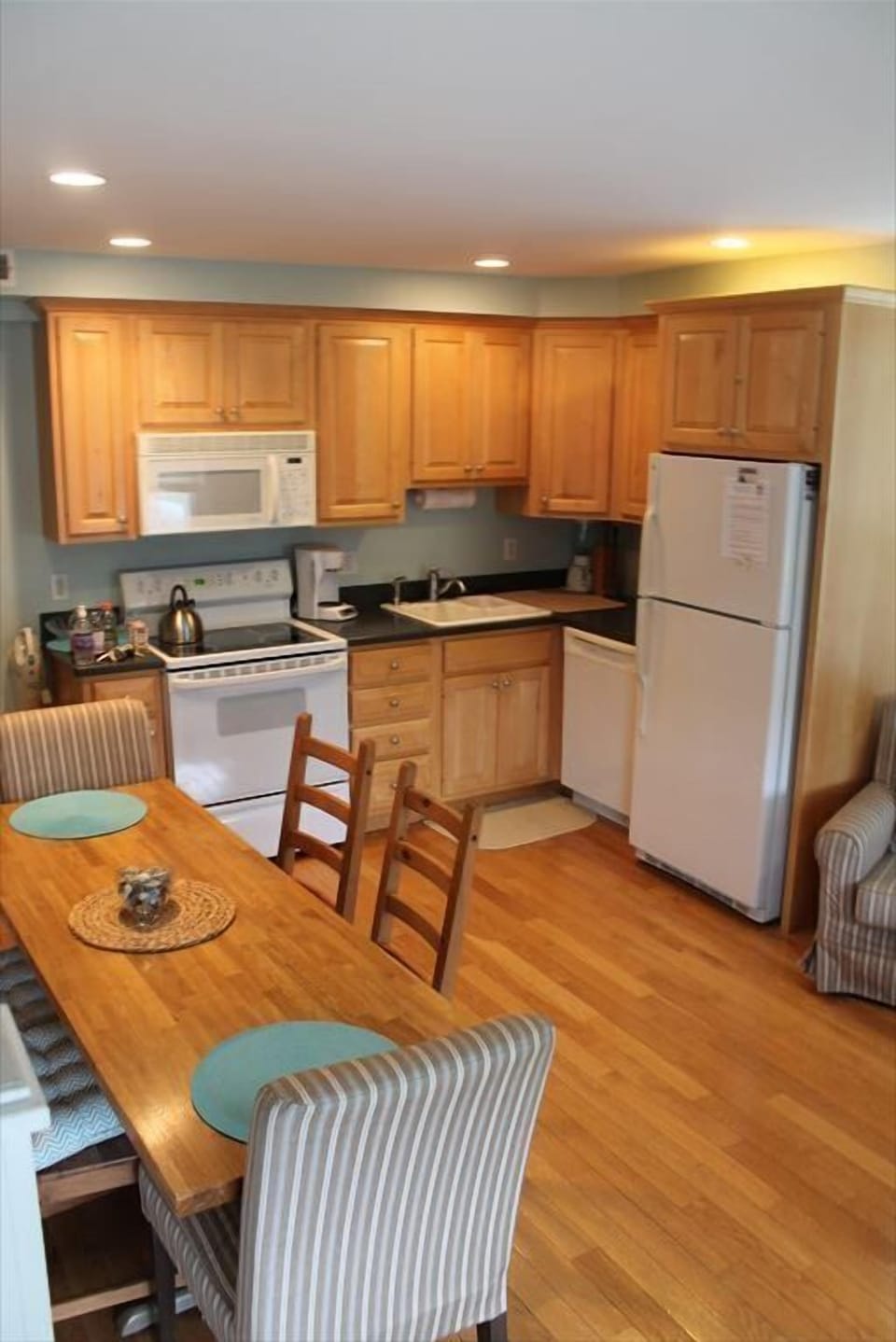 Spacious kitchen with modern appliances and a dining area ideal for family meals.