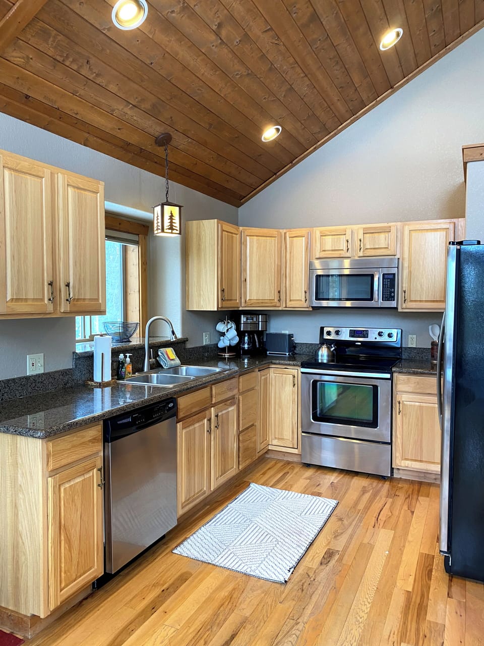 The well appointed Kitchen offers ample counter space, modern appliances and numerous kitchen gadgets and accouterments