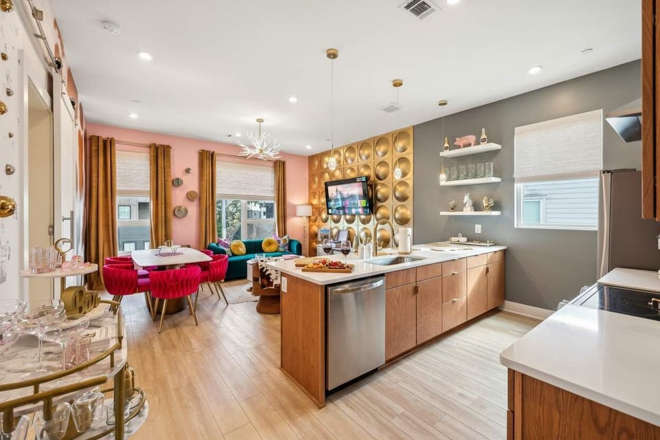 Explore this chic Nashville oasis with vibrant decor and modern luxury! Perfect for large groups or bachelorette parties, its open layout is ideal for celebrations. Host friends in the elegant kitchen before diving into downtown nightlife. Your luxurious getaway awaits!