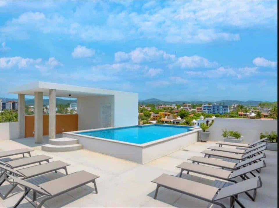 You’ll have a mountain and sea view rooftop pool and lounge with covered poolside dining, BBQ, and bar area