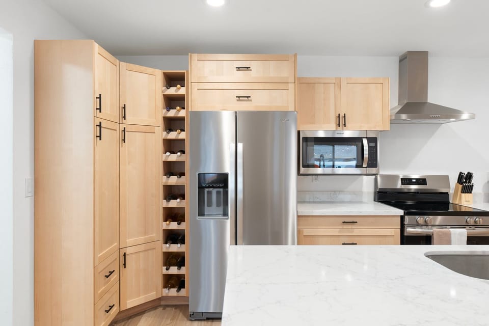 Features a large fridge and plenty of cabinetry, making meal prep a breeze.