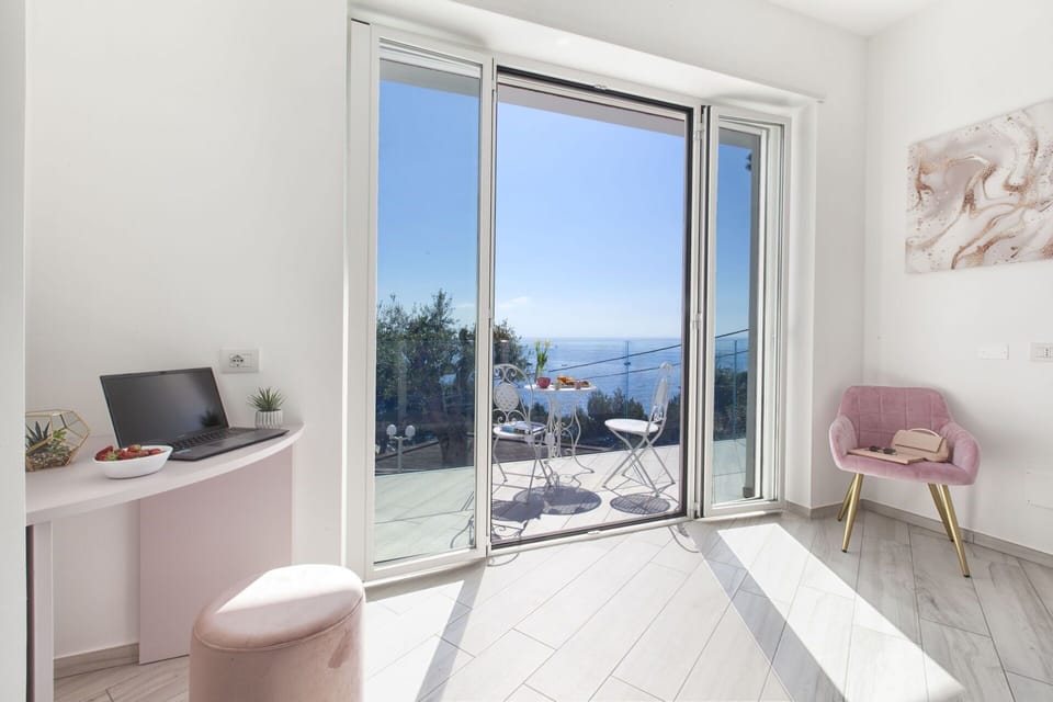 Flooring, Floor, Apartment, Sea, Chair, Balcony, Ocean, Wood Flooring, Coast, Home Door