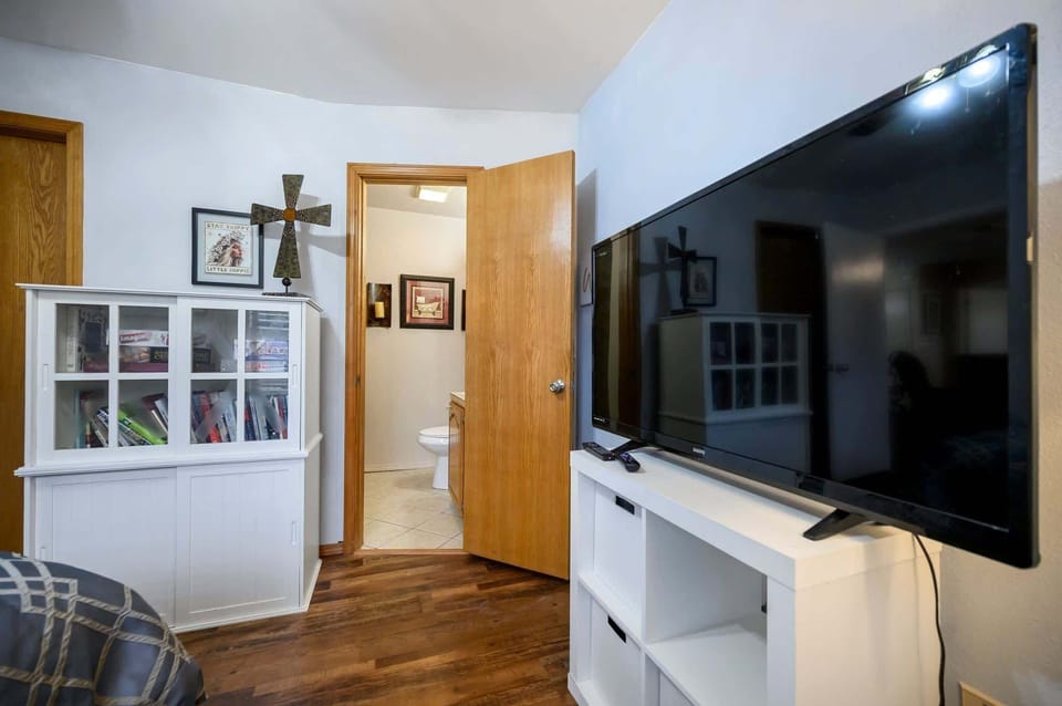 A cozy queen bed, smart TV, & ensuite await in the second suite