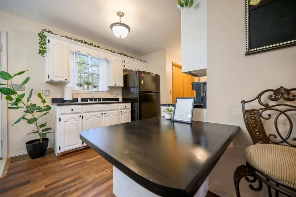 The airy kitchen offers ample space & all the comforts of home