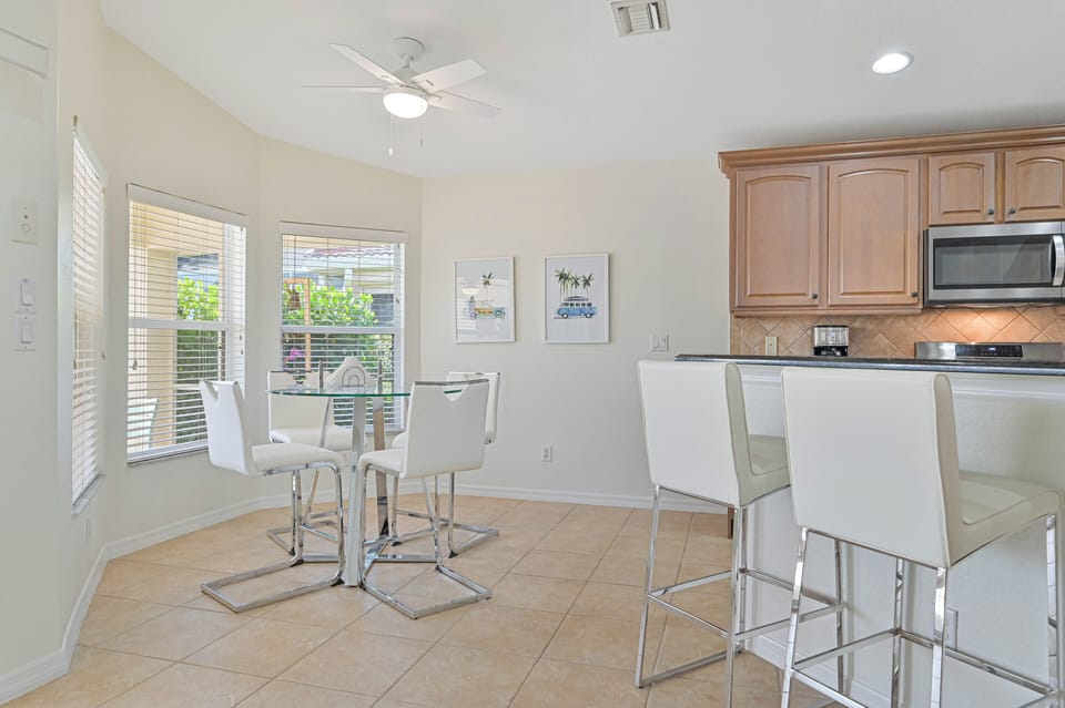 Lake Vista - Fully equipped kitchen with breakfast bar and the breakfast nook offers beautiful pool and lake view