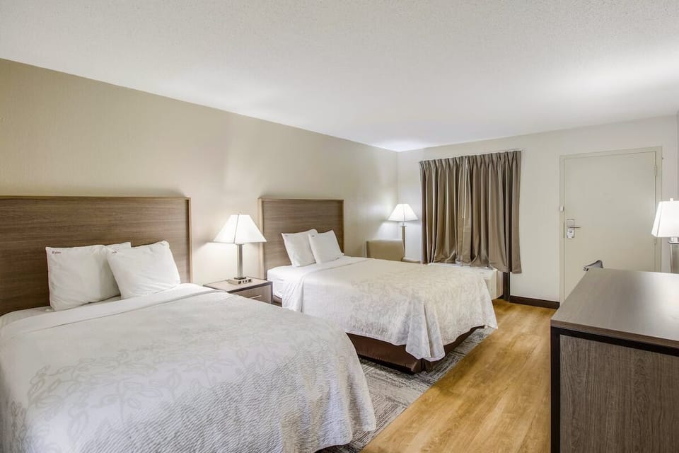 Sleep in quietly with blackout curtains and soft, inviting beds.